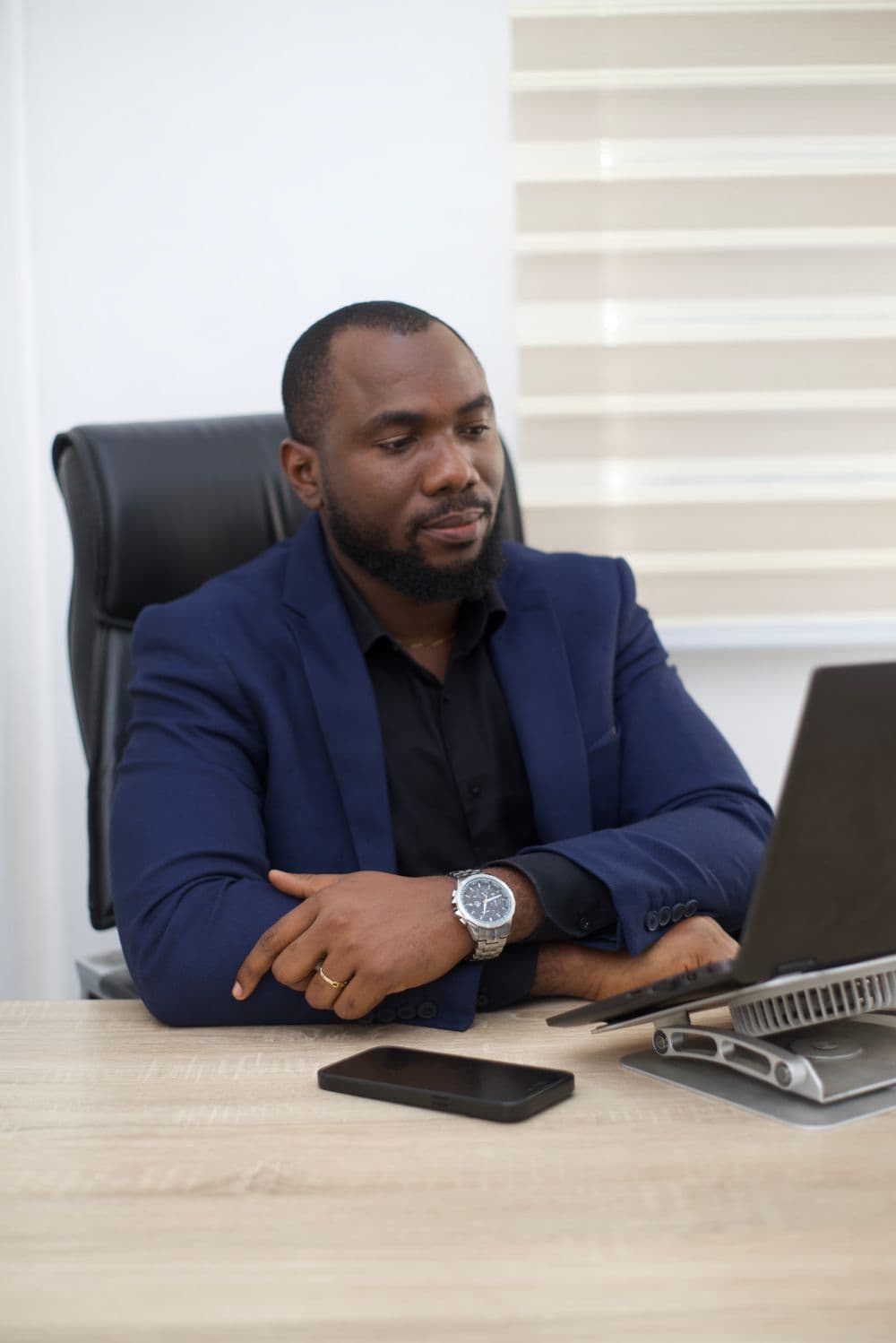 The founder of Nexplay working at his desk in Lagos
