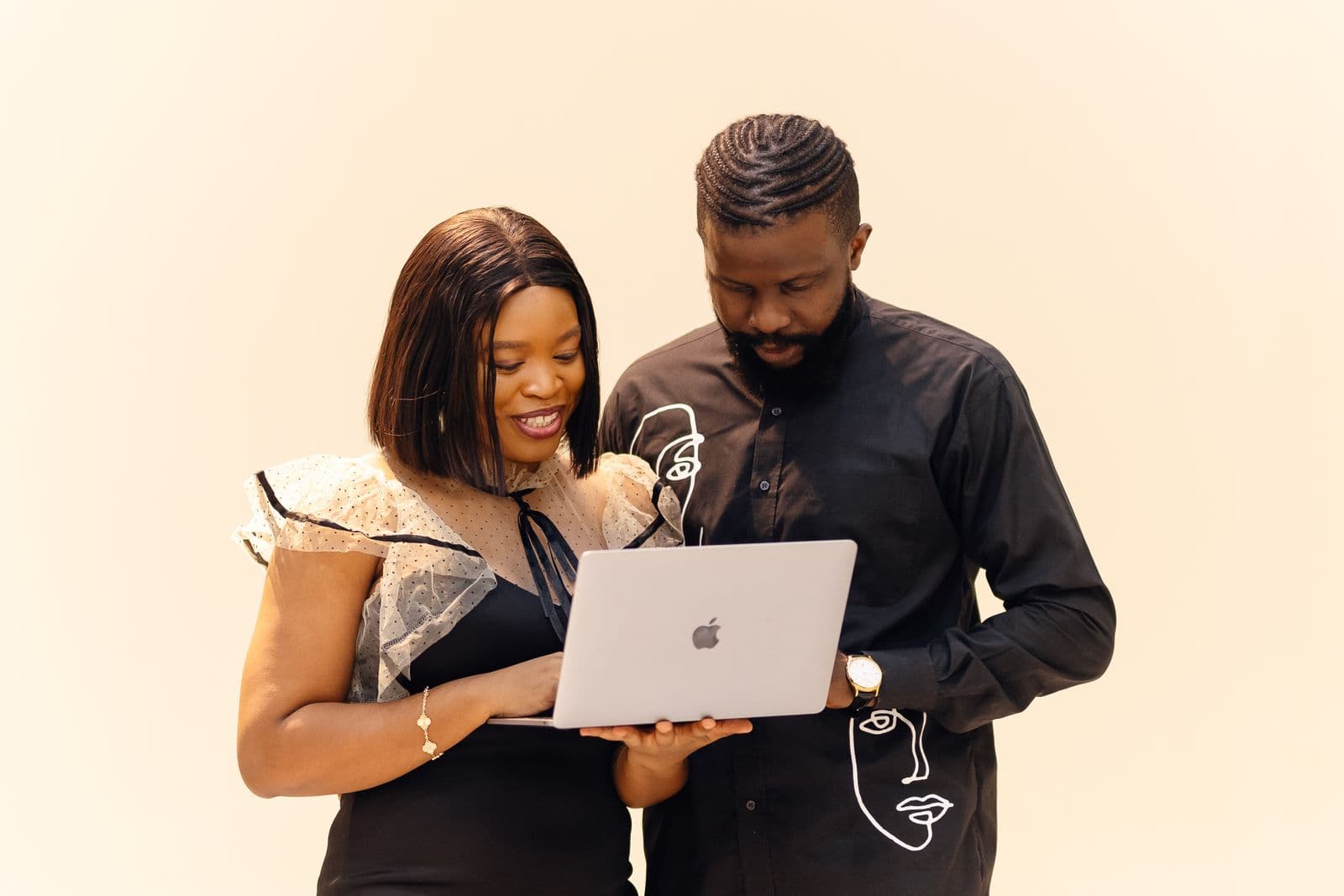 Two Nexplay clients reviewing a web app on a laptop